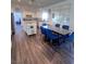 Well-lit kitchen and dining area with modern design and wood flooring at 2229 Armacost Dr, Henderson, NV 89074