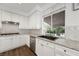 Updated kitchen featuring white cabinetry, stainless steel appliances, and granite countertops at 2229 Armacost Dr, Henderson, NV 89074