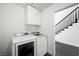Laundry room with modern washer and dryer, and white cabinets at 2229 Armacost Dr, Henderson, NV 89074