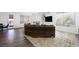 Spacious living room with a comfortable sofa, hardwood floors, fireplace, and a TV at 2229 Armacost Dr, Henderson, NV 89074