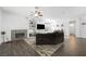 Bright living room featuring a fireplace, dark wood floors, and an open layout at 2229 Armacost Dr, Henderson, NV 89074