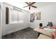 A simple office with a wooden desk, modern floors and minimal decorations at 2229 Armacost Dr, Henderson, NV 89074