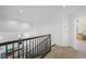 A staircase with dark wood railings and beige carpet at 2229 Armacost Dr, Henderson, NV 89074