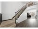 An interior staircase with carpet runner, hardwood floors and views of the living room below at 2229 Armacost Dr, Henderson, NV 89074