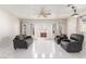 Bright living room with tile floor, fireplace, ceiling fan, and neutral walls at 2254 Florence Ave, Las Vegas, NV 89119