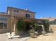 Features a covered patio for relaxing and decorative plants providing a calm, welcoming space at 2406 Pebble Springs Ct, Henderson, NV 89074