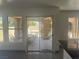 Light-filled living room offering access to the covered patio and backyard views at 2406 Pebble Springs Ct, Henderson, NV 89074