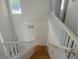 Bright two-story home featuring a staircase with wooden steps and white railing at 2406 Pebble Springs Ct, Henderson, NV 89074