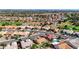 Wide aerial shot of a residential area with golf course and mountain views in the background at 2605 Orchid Valley Dr, Las Vegas, NV 89134