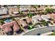 Aerial view of a home with a putting green, desert landscaping, swimming pool, solar panels and terracotta roof at 2605 Orchid Valley Dr, Las Vegas, NV 89134