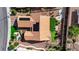 Aerial view showcases a home with a terracotta tile roof, green lawns, solar panels, and desert landscaping at 2605 Orchid Valley Dr, Las Vegas, NV 89134