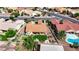 Aerial view showcases a putting green, desert landscaping, covered patio, and a swimming pool at 2605 Orchid Valley Dr, Las Vegas, NV 89134