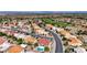 Aerial image of a neighborhood showcasing desert landscaping, and a nearby golf course at 2605 Orchid Valley Dr, Las Vegas, NV 89134