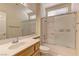 Clean bathroom featuring a vanity, toilet, and shower with sliding glass doors at 2605 Orchid Valley Dr, Las Vegas, NV 89134