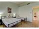 Bright bedroom featuring hardwood floors, two beds, and a light blue paint at 2605 Orchid Valley Dr, Las Vegas, NV 89134
