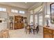 Cozy dining area with natural lighting, neutral colors, and tile flooring at 2605 Orchid Valley Dr, Las Vegas, NV 89134