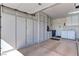 Spacious garage with ample built-in storage cabinets and a laundry area at 2605 Orchid Valley Dr, Las Vegas, NV 89134