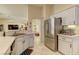 Bright kitchen with stainless steel appliances, ample counter space, and tile flooring at 2605 Orchid Valley Dr, Las Vegas, NV 89134