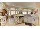 Spacious kitchen featuring white cabinets, a stainless steel dishwasher, and natural light at 2605 Orchid Valley Dr, Las Vegas, NV 89134