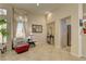 Inviting sitting room features neutral palette, tile floors and lots of natural light at 2605 Orchid Valley Dr, Las Vegas, NV 89134