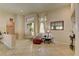 Inviting sitting area with tile flooring, neutral decor, and front entrance access at 2605 Orchid Valley Dr, Las Vegas, NV 89134