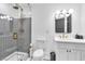 Modern bathroom with stylish vanity, fixtures and a glass-enclosed shower with sleek gold hardware at 3189 Montecito Dr, Las Vegas, NV 89120