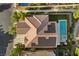 Stunning aerial view showcasing the house, the solar panels, the pool, spa, putting green and lush landscaping at 364 Trentino Alto St, Henderson, NV 89012