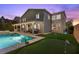 A spacious backyard features a pool, spa, putting green, and covered patio, creating an ideal outdoor retreat at 364 Trentino Alto St, Henderson, NV 89012