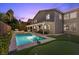 A lush backyard with a pool, putting green, and spacious patio provides the perfect space for outdoor activities at 364 Trentino Alto St, Henderson, NV 89012