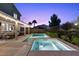 A large backyard featuring a pool and spa combo, covered patio, and ample landscaping is perfect for relaxing at 364 Trentino Alto St, Henderson, NV 89012