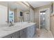 Modern bathroom with dual sinks, a marble countertop, and a bright, airy ambiance at 364 Trentino Alto St, Henderson, NV 89012