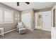 Comfortable bedroom features a ceiling fan, closet, chair, and natural light from the window at 364 Trentino Alto St, Henderson, NV 89012