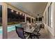 Enjoy an outdoor living area featuring a dining table, grill, and easy access to the pool for entertaining at 364 Trentino Alto St, Henderson, NV 89012