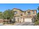 Charming two-story home featuring a stucco exterior, stone accents, and a well-maintained landscape at 364 Trentino Alto St, Henderson, NV 89012