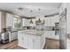 Modern kitchen featuring white cabinetry, stainless steel appliances, and a large island at 364 Trentino Alto St, Henderson, NV 89012