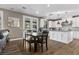Open kitchen with granite counters, stainless steel appliances and dining area with patio access at 364 Trentino Alto St, Henderson, NV 89012