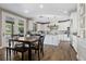 Bright, modern kitchen with white cabinetry, stainless steel appliances and eat-in dining area at 364 Trentino Alto St, Henderson, NV 89012