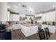 Modern kitchen with white cabinets, stainless appliances and a large island at 364 Trentino Alto St, Henderson, NV 89012