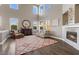 Elegant living room featuring high ceilings, abundant natural light, and a stylish fireplace at 364 Trentino Alto St, Henderson, NV 89012