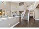 Spacious living room with a fireplace, hardwood floors, and a two-story foyer with staircase at 364 Trentino Alto St, Henderson, NV 89012