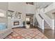 Bright and airy living room boasting hardwood floors, a cozy fireplace, and an open view to the dining area at 364 Trentino Alto St, Henderson, NV 89012