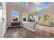 Elegant living room featuring high ceilings, abundant natural light, hardwood floors, and a stylish fireplace at 364 Trentino Alto St, Henderson, NV 89012