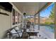 Relaxing covered patio with comfortable seating, fire pit, dining area, and a view of the sparkling pool at 364 Trentino Alto St, Henderson, NV 89012