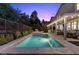 This sparkling pool and landscaped backyard provide a serene outdoor living space, great for relaxation and fun at 364 Trentino Alto St, Henderson, NV 89012
