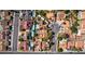 An aerial view shows houses with pools and solar panels in a well-planned neighborhood with a cul-de-sac at 3877 Platis Cir, Las Vegas, NV 89103