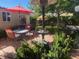 An outdoor patio seating area with dining table and chairs, providing comfort and entertainment at 3877 Platis Cir, Las Vegas, NV 89103