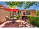 Cozy outdoor patio features a charming fireplace, perfect for relaxation and entertaining guests at 3877 Platis Cir, Las Vegas, NV 89103