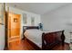 Comfortable bedroom featuring wood floors, neutral walls, and a bright window view at 3877 Platis Cir, Las Vegas, NV 89103