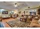 Large living room with hardwood floors, ceiling fan and elegant furniture is displayed at 3877 Platis Cir, Las Vegas, NV 89103