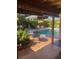 Relaxing pool with chairs and umbrella, ideal for leisure and entertaining in a great outdoor space at 3877 Platis Cir, Las Vegas, NV 89103